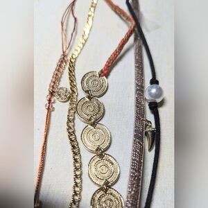 Five necklaces from Tanya creations each about a foot long and adjustable. NWT.